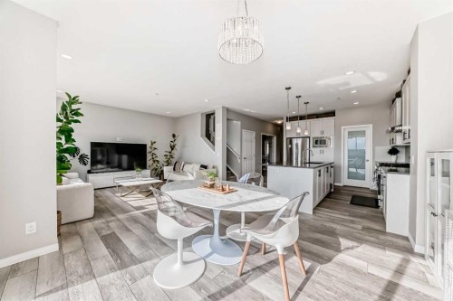 73 Lucas Heights Nw, Calgary, AB - Indoor Photo Showing Dining Room With Fireplace