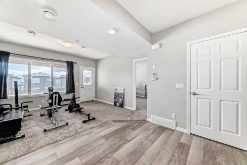 73 Lucas Heights Nw, Calgary, AB - Indoor Photo Showing Gym Room