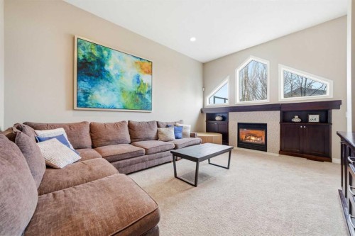 244 Cove Road, Chestermere, AB - Indoor Photo Showing Living Room With Fireplace
