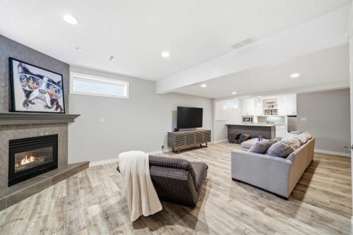 244 Cove Road, Chestermere, AB - Indoor Photo Showing Living Room With Fireplace