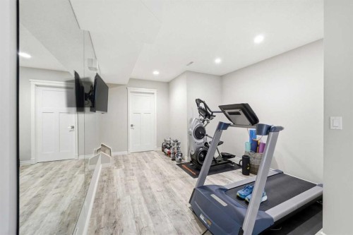 244 Cove Road, Chestermere, AB - Indoor Photo Showing Gym Room