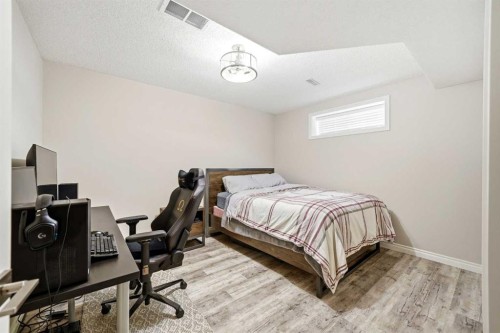 244 Cove Road, Chestermere, AB - Indoor Photo Showing Bedroom