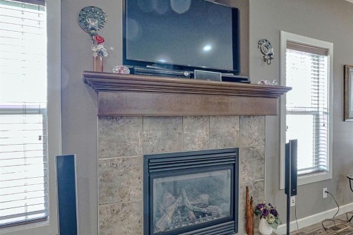 1936 High Park Circle Nw, High River, AB - Indoor Photo Showing Living Room With Fireplace