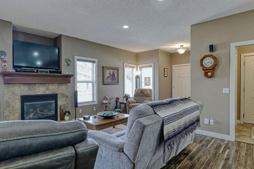 1936 High Park Circle Nw, High River, AB - Indoor Photo Showing Living Room With Fireplace