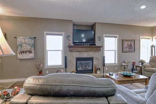1936 High Park Circle Nw, High River, AB - Indoor Photo Showing Living Room With Fireplace