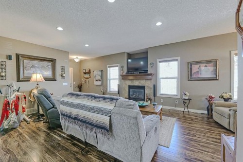 1936 High Park Circle Nw, High River, AB - Indoor Photo Showing Living Room With Fireplace