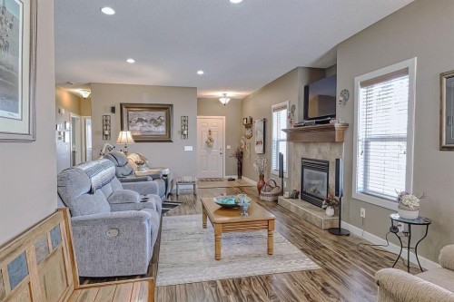 1936 High Park Circle Nw, High River, AB - Indoor Photo Showing Living Room With Fireplace