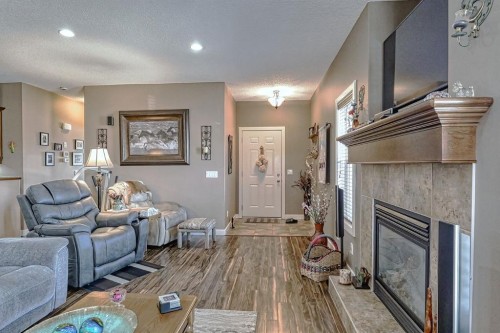 1936 High Park Circle Nw, High River, AB - Indoor Photo Showing Living Room With Fireplace
