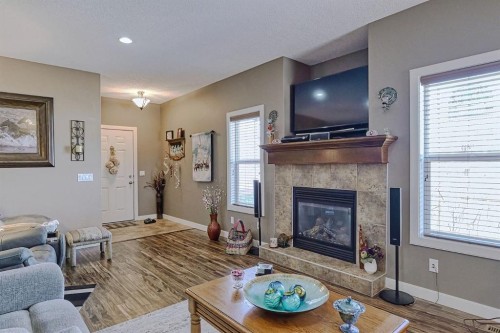 1936 High Park Circle Nw, High River, AB - Indoor Photo Showing Living Room With Fireplace