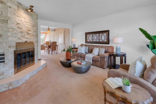 1031 Thorneycroft Drive Nw, Calgary, AB - Indoor Photo Showing Living Room With Fireplace