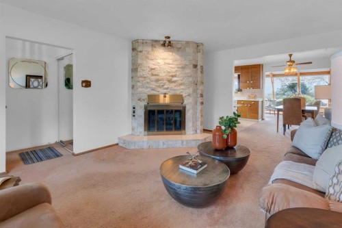 1031 Thorneycroft Drive Nw, Calgary, AB - Indoor Photo Showing Living Room With Fireplace