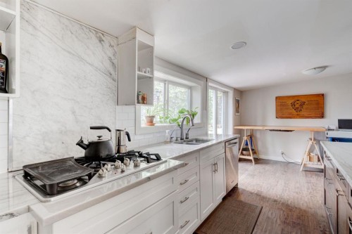 84 Burney, Bragg Creek, AB - Indoor Photo Showing Kitchen With Double Sink With Upgraded Kitchen