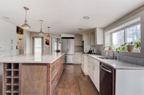 84 Burney, Bragg Creek, AB - Indoor Photo Showing Kitchen With Upgraded Kitchen