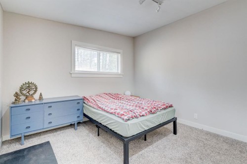 84 Burney, Bragg Creek, AB - Indoor Photo Showing Bedroom
