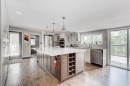84 Burney, Bragg Creek, AB  - Indoor Photo Showing Kitchen With Upgraded Kitchen 