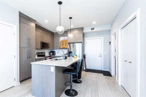1317-681 Savanna Boulevard North, Calgary, AB - Indoor Photo Showing Kitchen With Stainless Steel Kitchen With Upgraded Kitchen