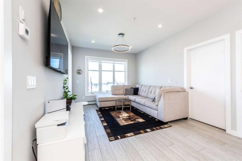 1317-681 Savanna Boulevard North, Calgary, AB - Indoor Photo Showing Living Room