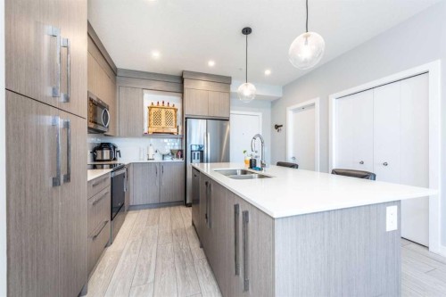 1317-681 Savanna Boulevard North, Calgary, AB - Indoor Photo Showing Kitchen With Stainless Steel Kitchen With Double Sink With Upgraded Kitchen
