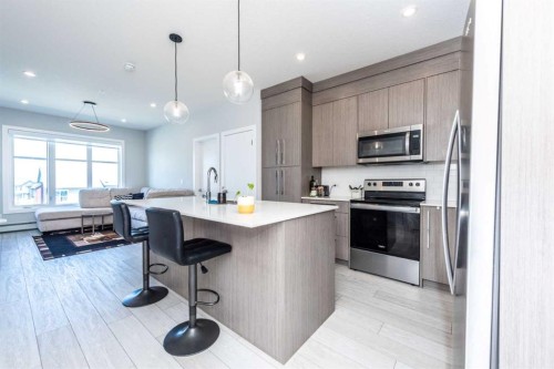 1317-681 Savanna Boulevard North, Calgary, AB - Indoor Photo Showing Kitchen With Stainless Steel Kitchen With Upgraded Kitchen