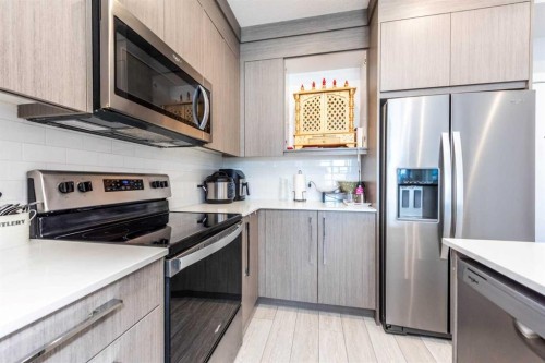 1317-681 Savanna Boulevard North, Calgary, AB - Indoor Photo Showing Kitchen With Stainless Steel Kitchen With Upgraded Kitchen