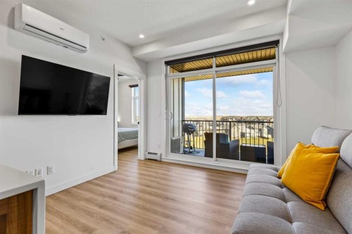 404-50 Sage Hill Walk Nw, Calgary, AB - Indoor Photo Showing Living Room