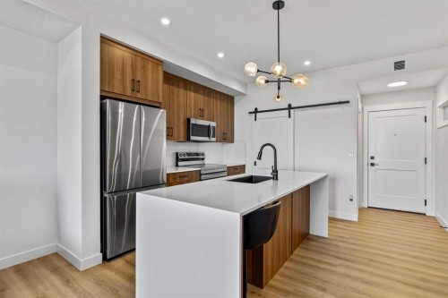 404-50 Sage Hill Walk Nw, Calgary, AB - Indoor Photo Showing Kitchen With Upgraded Kitchen