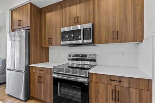 404-50 Sage Hill Walk Nw, Calgary, AB - Indoor Photo Showing Kitchen
