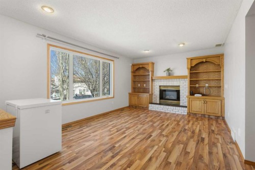 119 Citadel Hills Place Nw, Calgary, AB - Indoor Photo Showing Living Room With Fireplace