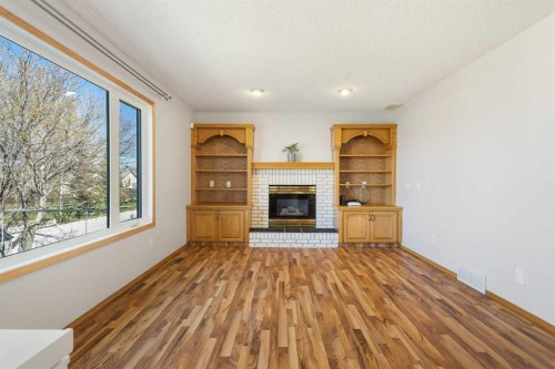 119 Citadel Hills Place Nw, Calgary, AB - Indoor Photo Showing Living Room With Fireplace