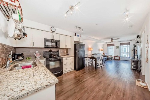 6315-755 Copperpond Boulevard Se, Calgary, AB - Indoor Photo Showing Kitchen With Double Sink With Upgraded Kitchen