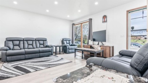379 Maitland Crescent Ne, Calgary, AB - Indoor Photo Showing Living Room