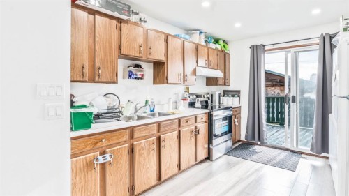 379 Maitland Crescent Ne, Calgary, AB - Indoor Photo Showing Kitchen With Double Sink