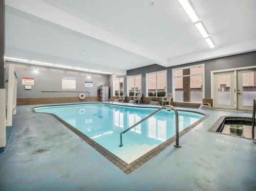 231-2020 32 Street South, Lethbridge, AB - Indoor Photo Showing Other Room With In Ground Pool