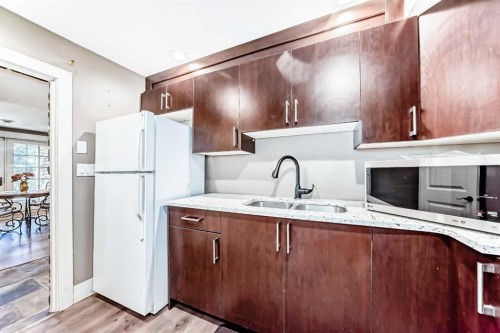10909 Eamon Road Nw, Calgary, AB - Indoor Photo Showing Kitchen With Double Sink