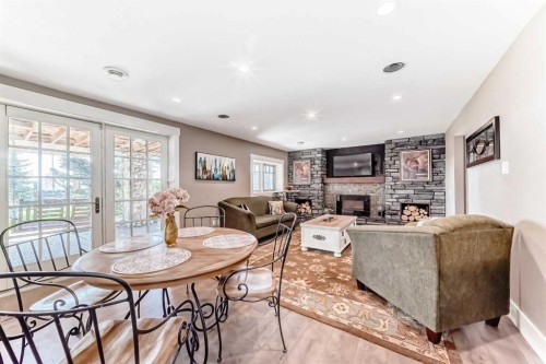 10909 Eamon Road Nw, Calgary, AB - Indoor Photo Showing Other Room With Fireplace