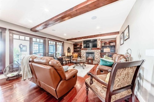 10909 Eamon Road Nw, Calgary, AB - Indoor Photo Showing Living Room With Fireplace