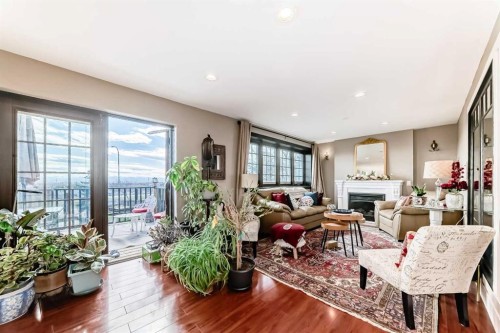 10909 Eamon Road Nw, Calgary, AB - Indoor Photo Showing Living Room With Fireplace