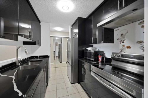 415-55 Arbour Grove Close Nw, Calgary, AB - Indoor Photo Showing Kitchen With Double Sink