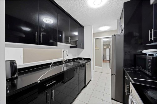 415-55 Arbour Grove Close Nw, Calgary, AB - Indoor Photo Showing Kitchen With Double Sink
