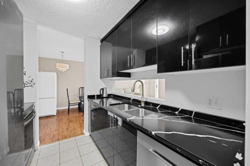 415-55 Arbour Grove Close Nw, Calgary, AB - Indoor Photo Showing Kitchen With Double Sink With Upgraded Kitchen