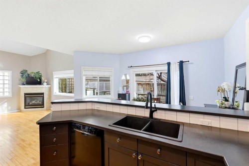 45 Patterson Hill Sw, Calgary, AB - Indoor Photo Showing Kitchen With Fireplace With Double Sink