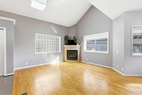45 Patterson Hill Sw, Calgary, AB - Indoor Photo Showing Living Room With Fireplace