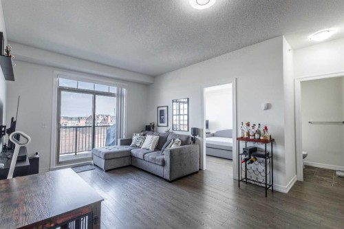 403-117 Copperpond Common Se, Calgary, AB - Indoor Photo Showing Living Room
