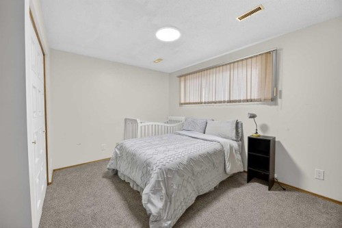 35 Queen Isabella Close Se, Calgary, AB - Indoor Photo Showing Bedroom
