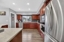 35 Queen Isabella Close Se, Calgary, AB  - Indoor Photo Showing Kitchen 