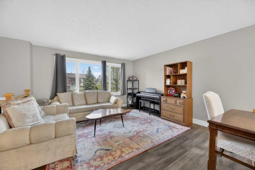 35 Queen Isabella Close Se, Calgary, AB - Indoor Photo Showing Living Room