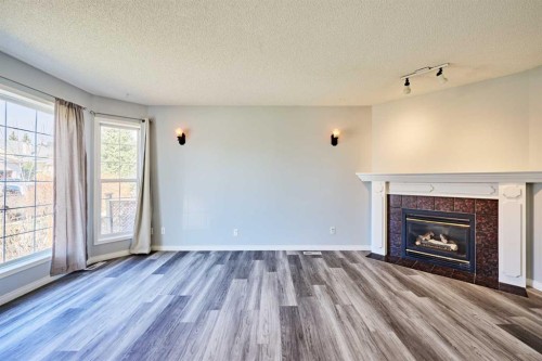 1085 Country Hills Circle Nw, Calgary, AB - Indoor Photo Showing Living Room With Fireplace