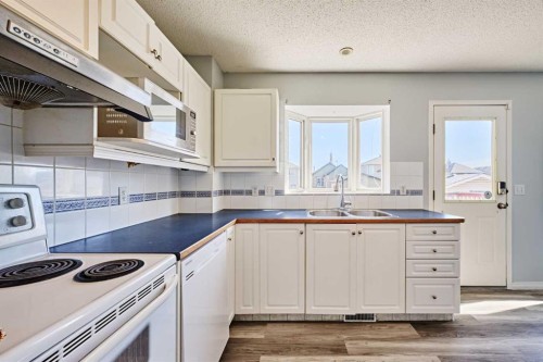 1085 Country Hills Circle Nw, Calgary, AB - Indoor Photo Showing Kitchen With Double Sink
