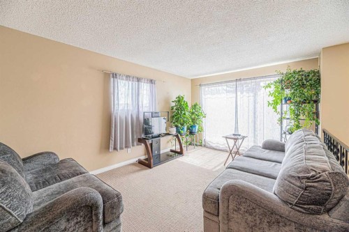 43 Abbercove Road Se, Calgary, AB - Indoor Photo Showing Living Room