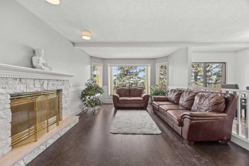 1360 Shawnee Road Sw, Calgary, AB - Indoor Photo Showing Living Room With Fireplace